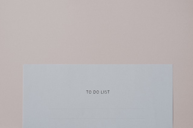 A piece of white paper displays the phrase ‘To Do List’. 