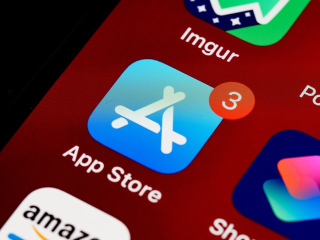 A close-up of the Apple App Store icon on the home screen of a phone.