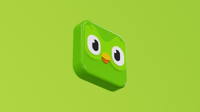 A 3D illustration of the Duolingo logo on a green background.