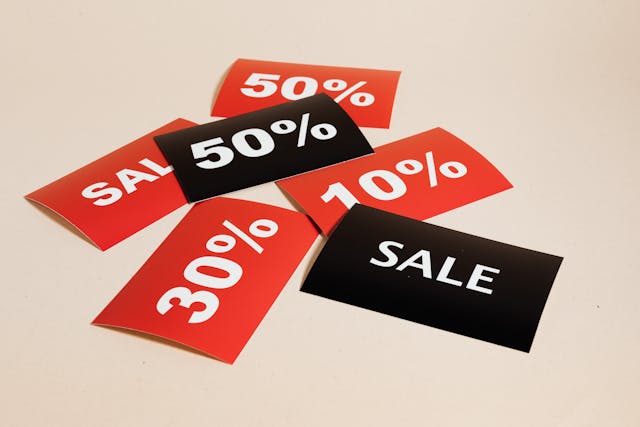 A group of black and red sale cards displaying different percentages representing CTAs.