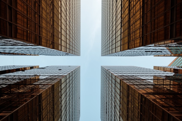 An image of four perfectly aligned buildings to represent symmetry. 
