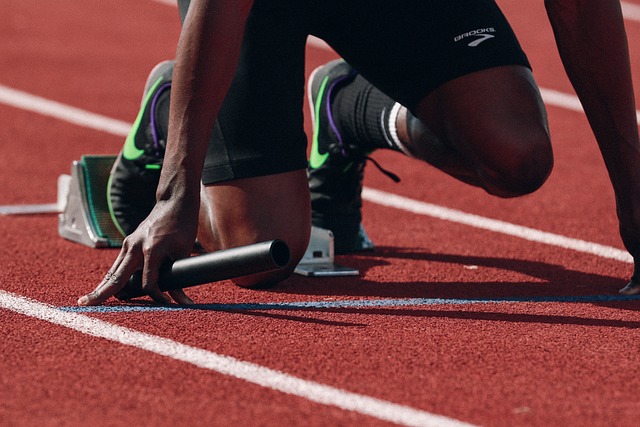 A close-up of an athlete’s starting position before a sprinting/running event. 
