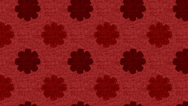 A picture of a red background with a maroon floral pattern on it. 
