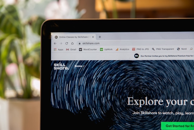 Laptop screen displaying a Skillshare homepage, representing the concept of landing pages versus homepages.