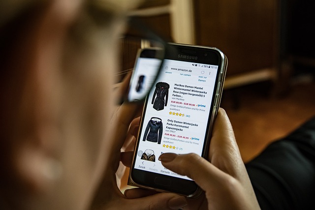 A close-up of a person shopping on Amazon for clothes, representing the “buy? stage of their journey.