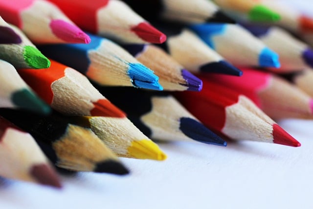 A close-up of a group of differently colored, bright pencils.