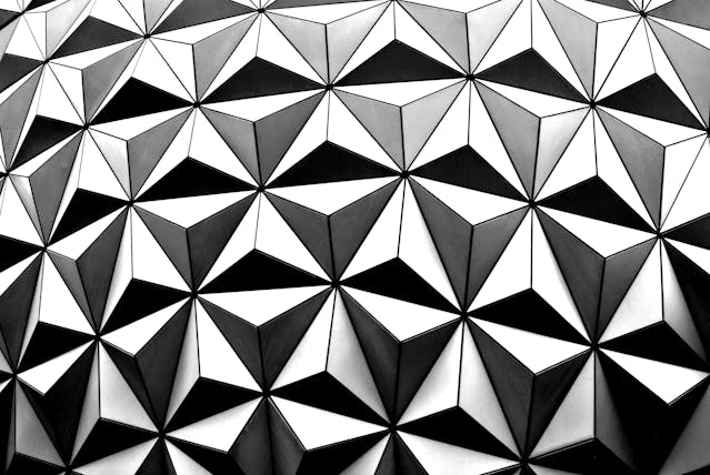 An example of an achromatic geometric pattern that comprises a series of identical triangles.
