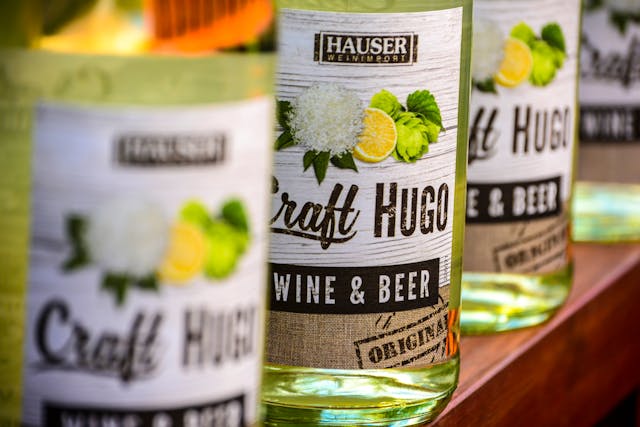 A close-up of a row of green and yellow bottles from Craft Hugo. 
