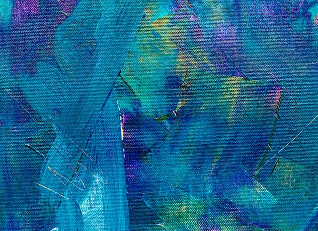 An example of a textural background that mimics the texture of a canvas covered in blue paint. 
