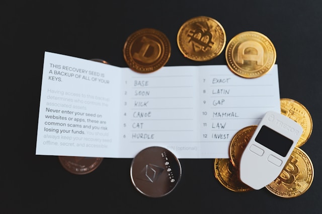 A secure crypto wallet recovery seed card with various coins representing crypto coins around it.