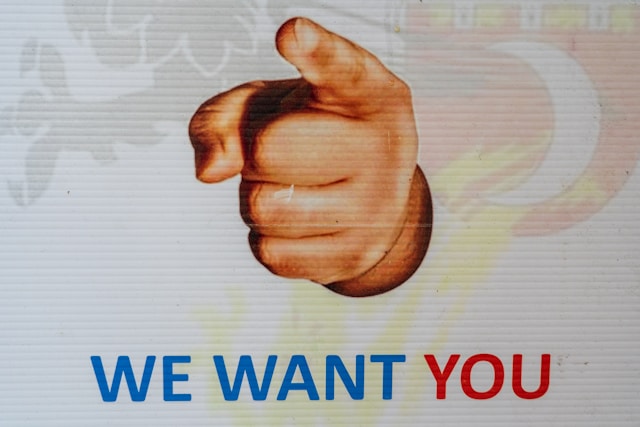 A sign saying “We want you.”